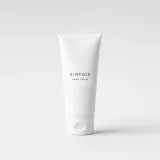 White squeeze tube with a label reading Kinfolk hand cream