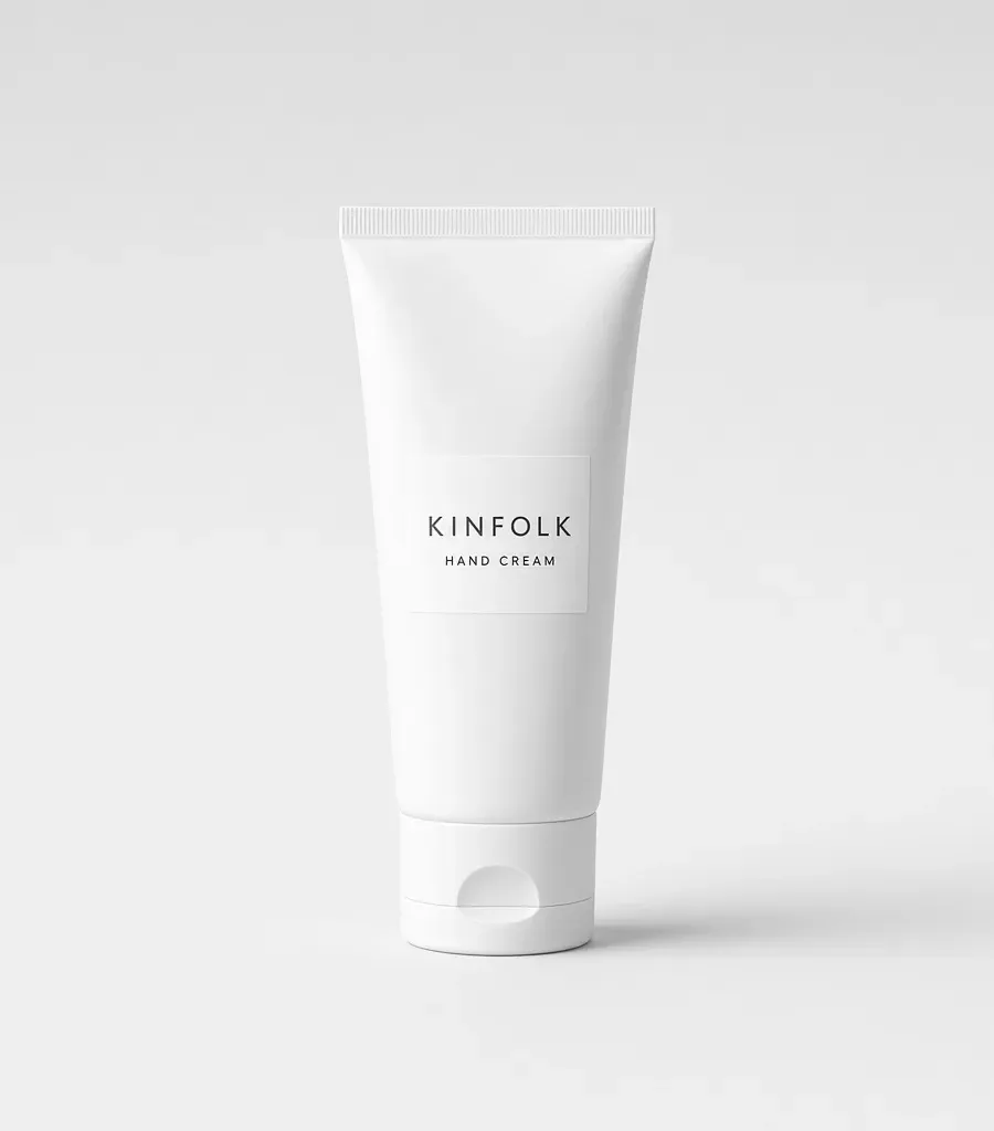 White squeeze tube with a label reading Kinfolk hand cream