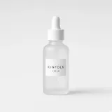 Frosted glass dropper bottle with a white label reading Kinfolk serum