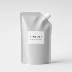 Aluminium refill pouch with a white spout and a label reading Kinfolk refill cleansing gel